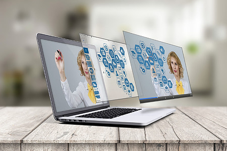 focal focus photography of turned on MacBook Pro with holographic display art thumbnail
