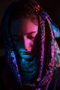 closeup photo of woman wearing multicolored veil with her eyes closed thumbnail