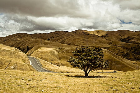 mountain under the cloudy sky during daytime thumbnail
