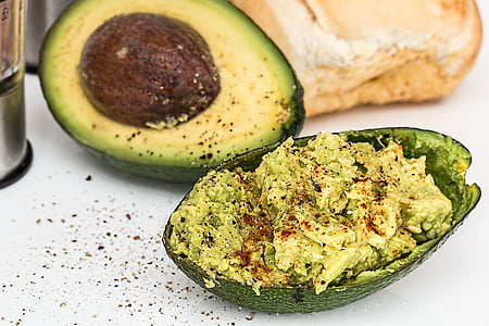 sliced avocado fruit beside bread thumbnail