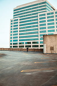 person standing in front of building thumbnail