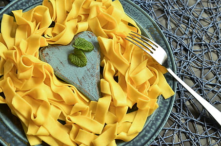 yellow pasta on gray plate thumbnail