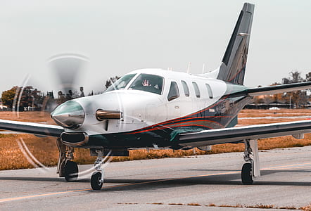 white and black private plane on plane ramp thumbnail