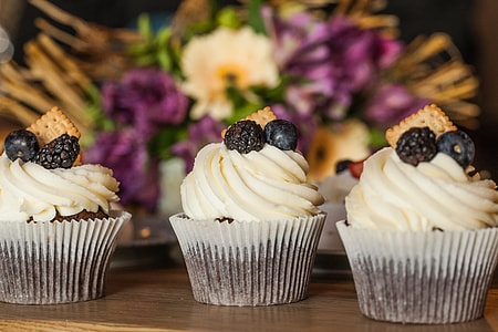 three white icing coated cupcakes thumbnail