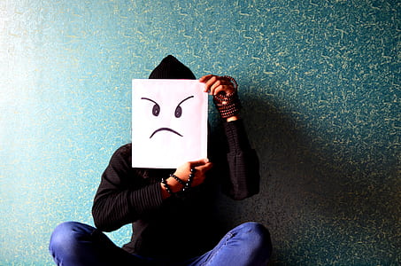 person holding white paper with mad face thumbnail