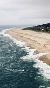 people swimming on body of water thumbnail