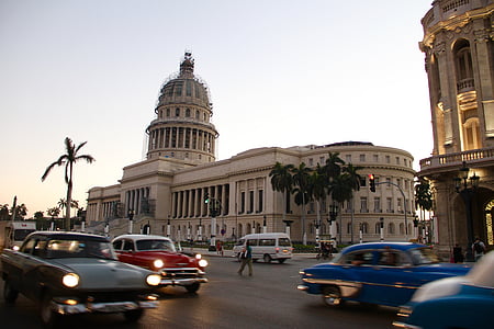 vehicles passing by building thumbnail