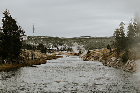 river between land during daytime thumbnail