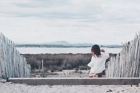 person standing in the middle of fences thumbnail