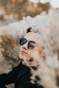 man wearing sunglasses in shallow focus photography thumbnail