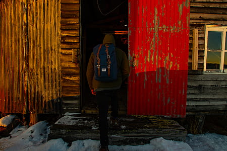 Person Wearing Beanies and Blue Rucksack thumbnail