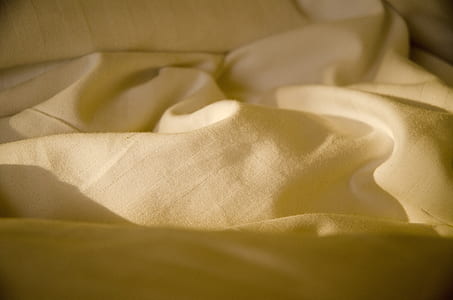 close-up photo of beige textile thumbnail