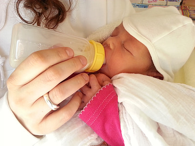 person carrying baby with white beanie thumbnail