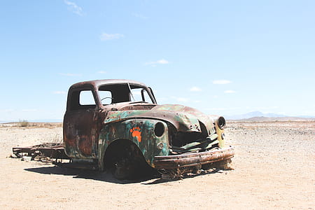 classic green and brown vehicle on desert thumbnail