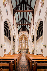 brown pews lined in church thumbnail