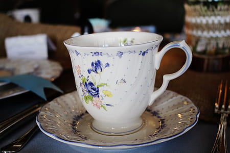 white and blue floral ceramic up on saucer thumbnail