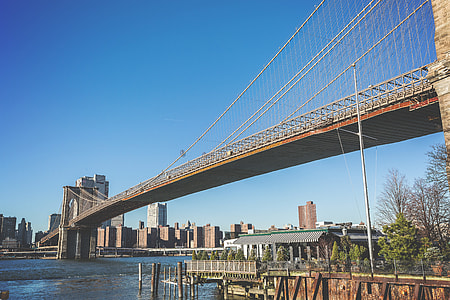 gray concrete bridge across body of water thumbnail