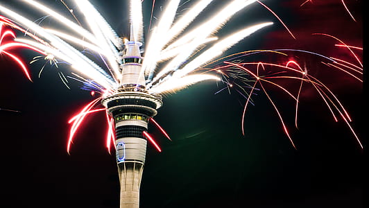 timelapse photo of fireworks on white high rise building thumbnail