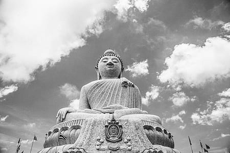 buddha statue under cloudy sky thumbnail