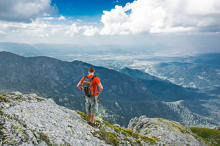 person standing on the edge of cliff thumbnail