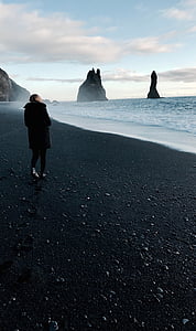 woman standing near seashore thumbnail
