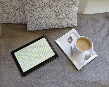 white ceramic mug and stainless steel spoon on white tray thumbnail
