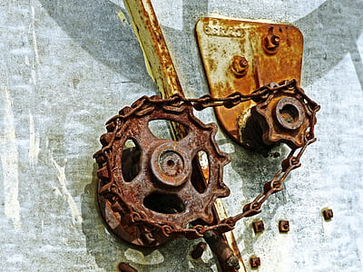 rusted brown metal gear with chain thumbnail