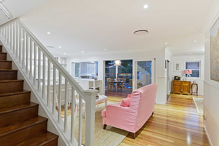 pink sofa in front of coffee table thumbnail