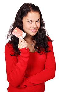 woman wearing red sweater holding red and white magnetic card thumbnail