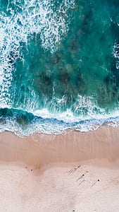 aerial view photography of sea waves at daytime thumbnail