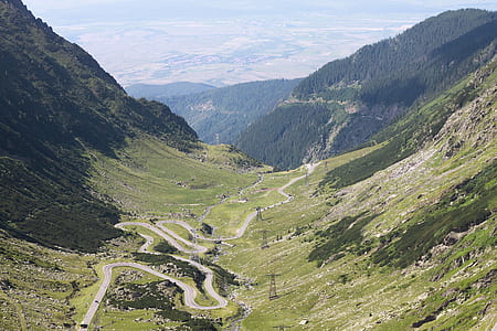 green mountains above highways at daytime thumbnail