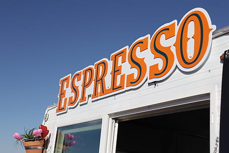 orange Espresso signage under clear blues ky thumbnail