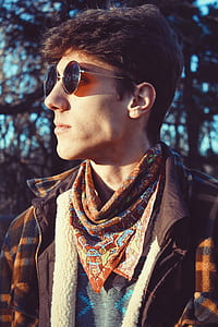 man wearing brown and black plaid coat thumbnail