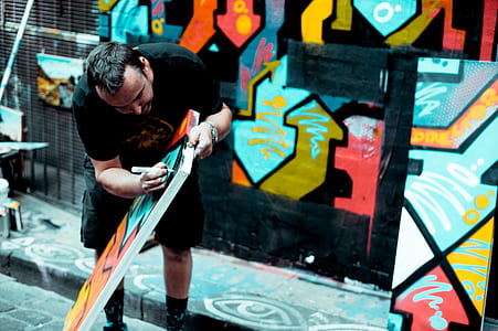 man carving during daytime thumbnail