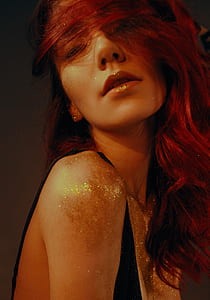 woman wearing black tank top with glitters on body thumbnail