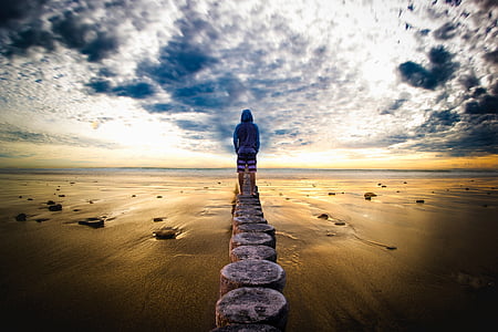 person standing on gray concrete dock thumbnail