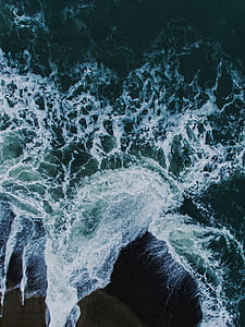 high angle photo of beach waves thumbnail