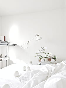 white floor lamp near white bedspread thumbnail