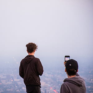 photo of man overlooking buildings thumbnail