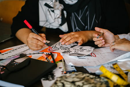 Person Writing on Paper on Top of Table thumbnail
