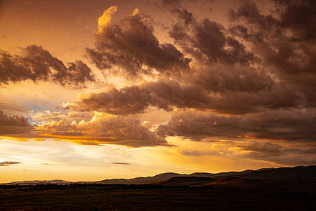 Orange Sunset With Clouds in Sky thumbnail