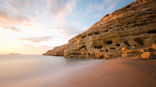 landscape photography of brown rocky hill under clear blue sky thumbnail