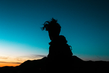 silhouette photography of person standing thumbnail