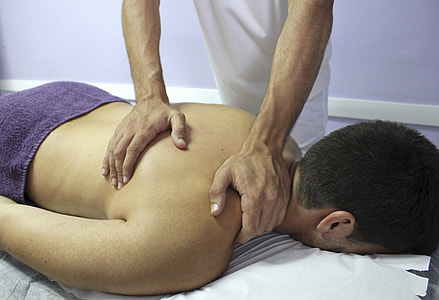 person massaging man on bed thumbnail