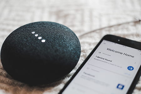 black speaker and iPhone on table thumbnail