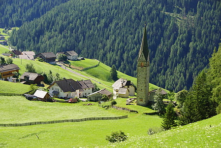 high angle photo of village on mountain slope thumbnail
