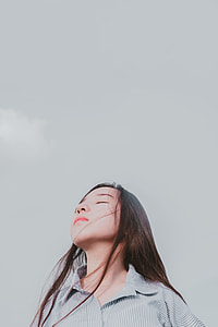 woman in black and white pinstripes dress shirt on white background thumbnail