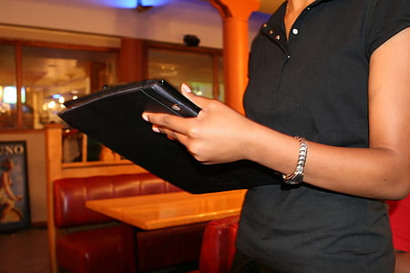 woman holding black case thumbnail