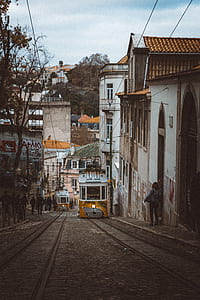 woman standing near the wall building at daytime thumbnail