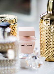 pink Narciso bottle near gold cocktail mixer thumbnail